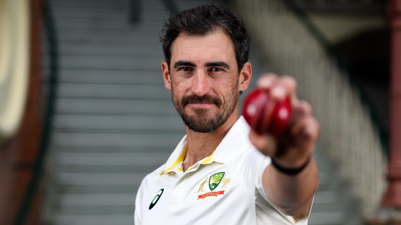 Mitchell Starc poses for a photo during