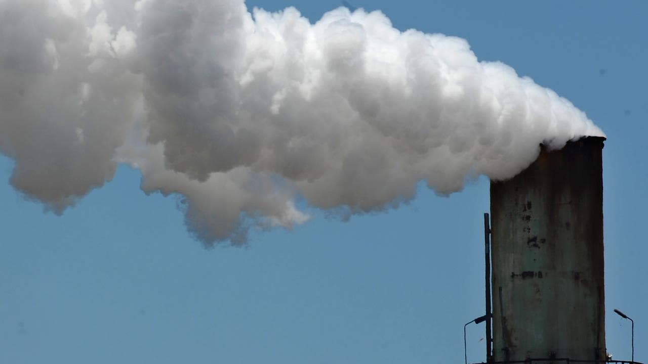 A generic photograph of a smoke stack.