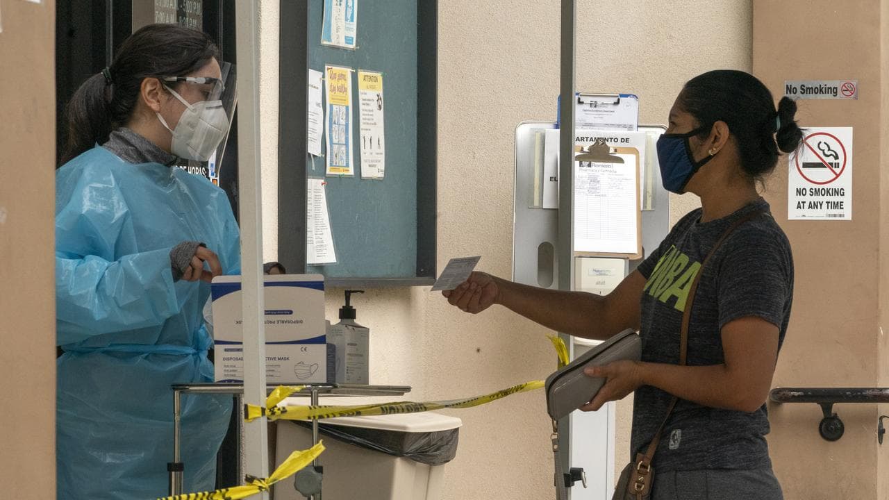 A US health worker with a patient