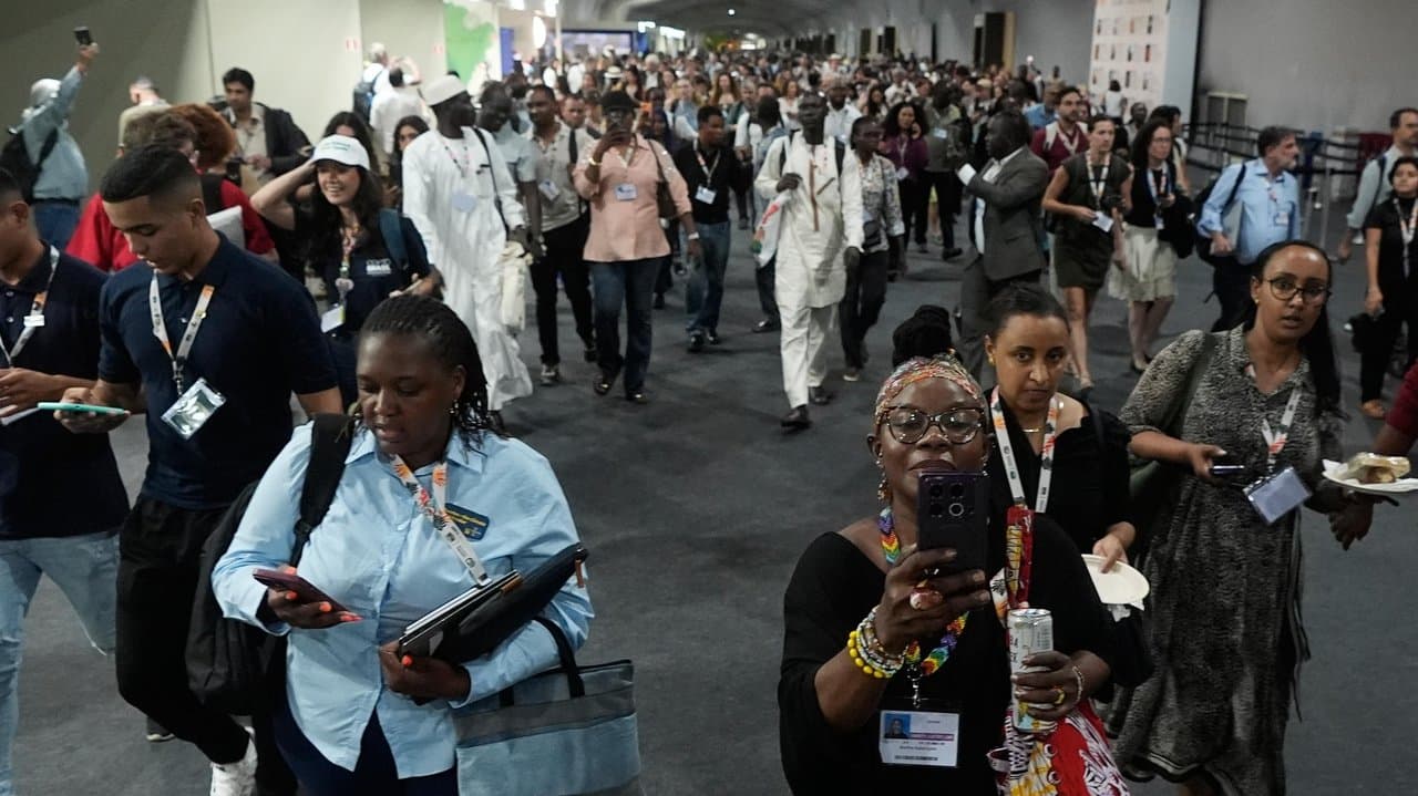 Attendees exit the venue for the COP30 summit
