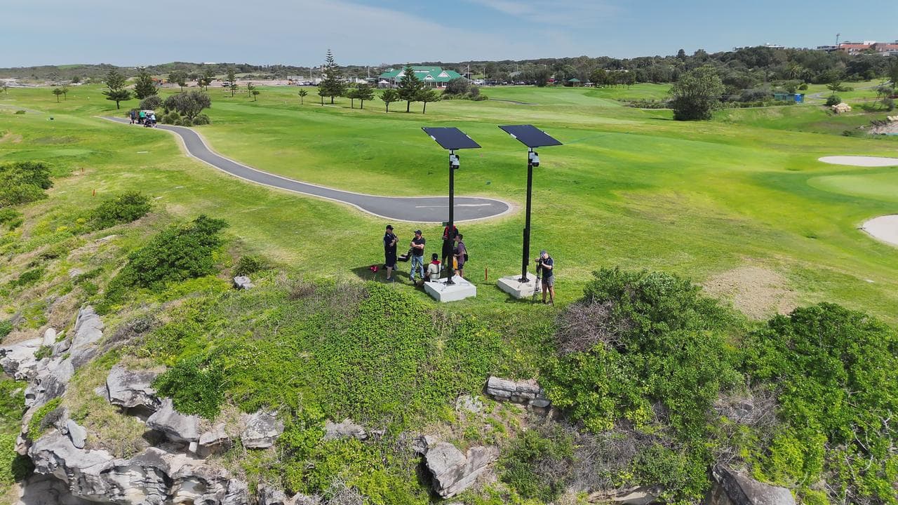 Cameras on a headland overlooking beach