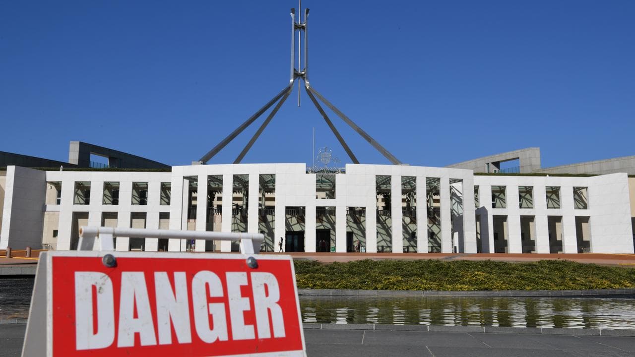 A Danger sign is seen at the front entrance of Parliament House