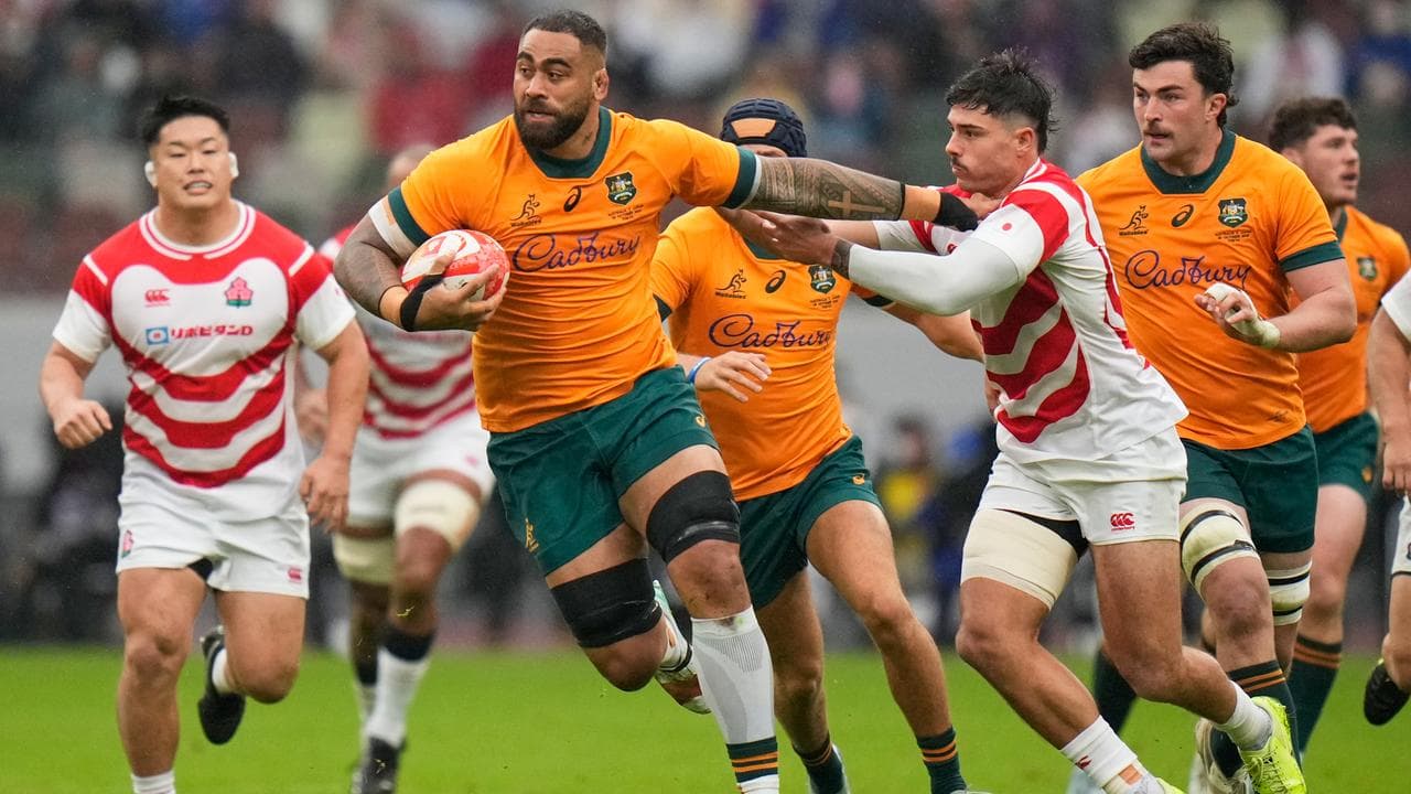 Australia's Lukhan Salakaia-Loto makes a run against Japan