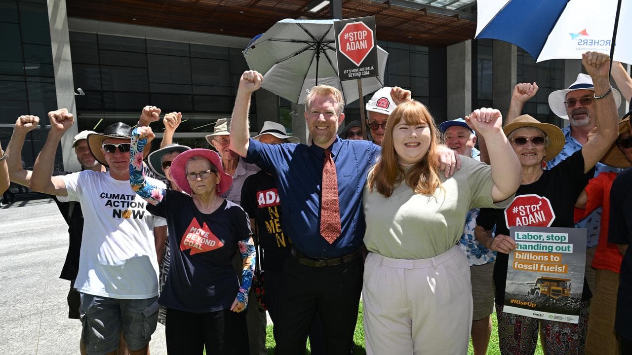 Ben Pennings and his daughter Isabella celebrate with supporters