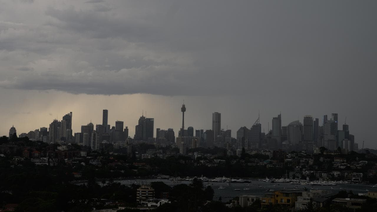 A thunderstorm is seen passing over the Sydney city