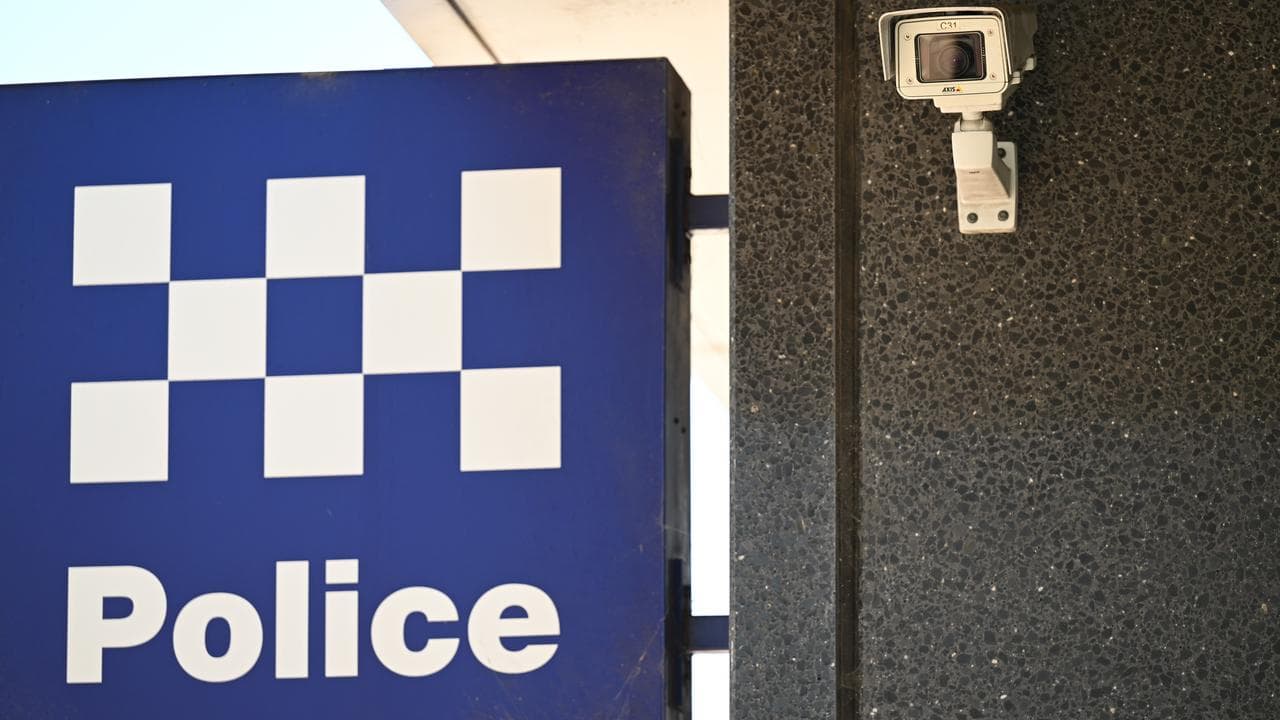 A NSW Police sign and security camera