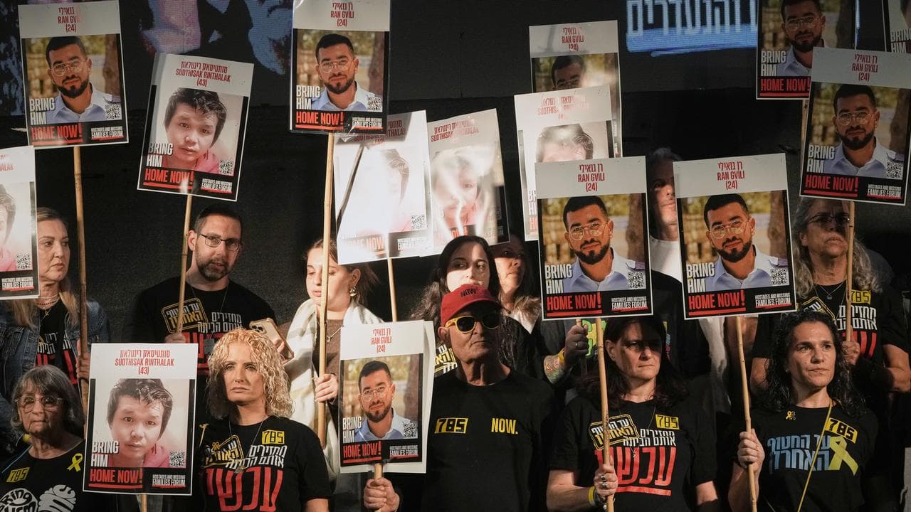 People attend a rally calling for the return of the deceased hostages