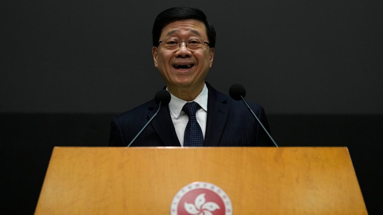 Hong Kong chief executive John Lee speaks at a media conference