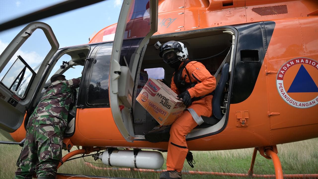 Aid helicopter in a flood-affected area in North Aceh, Indonesia