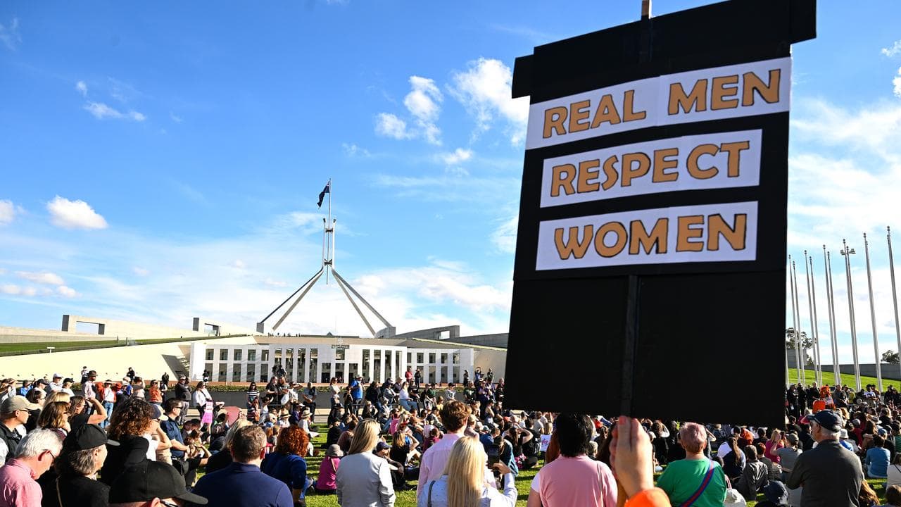 People at a rally calling for action to end violence against women.