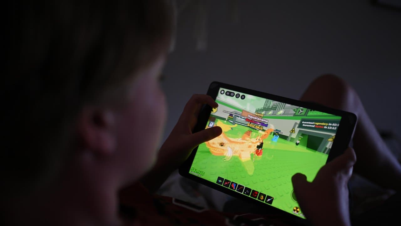 A 12-year-old boy plays a Roblox game