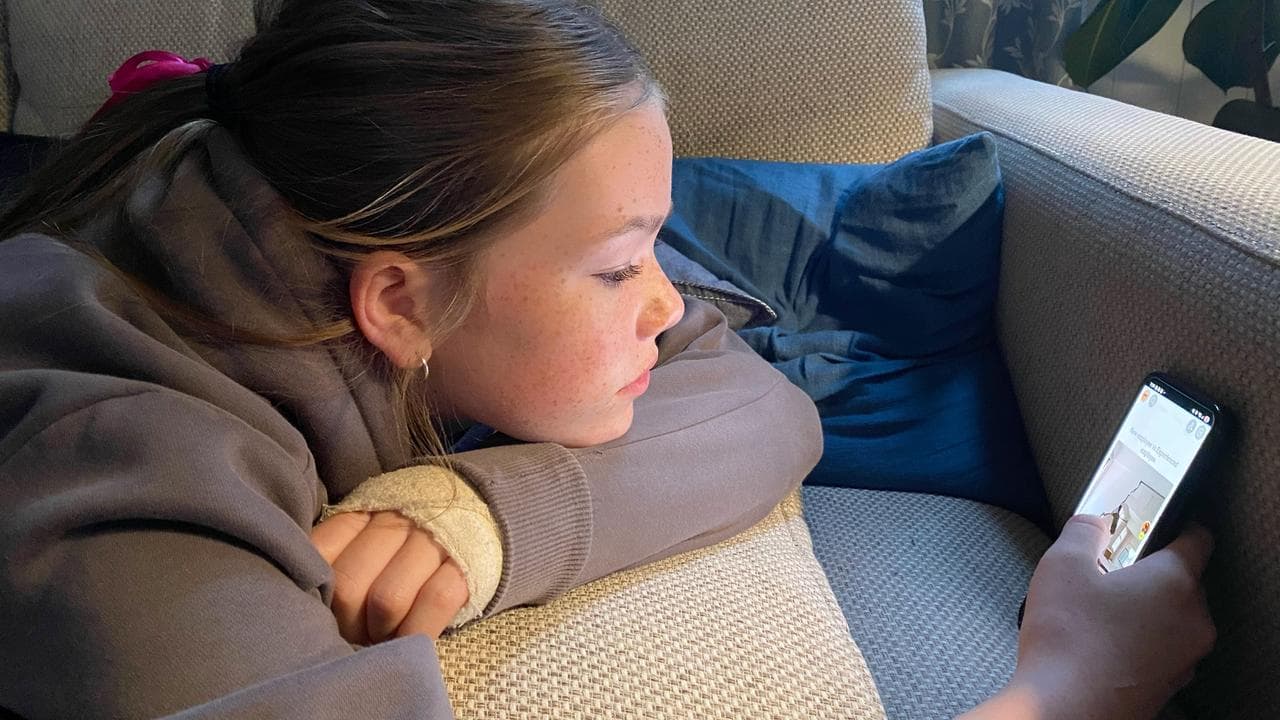 Pippa Martin, 13, does some final scrolling on her social media apps