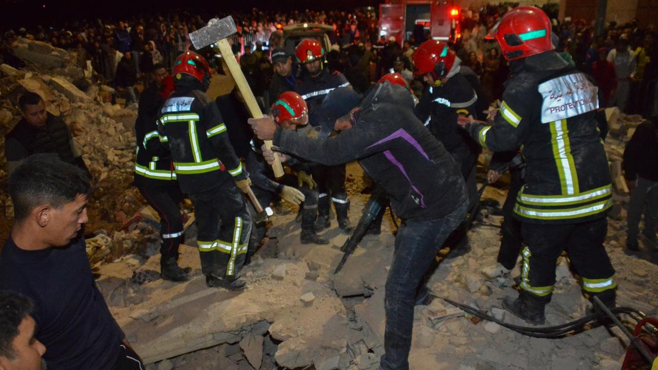 Rescue workers in the wreckage of collapsed buildings in Fez, Morocco