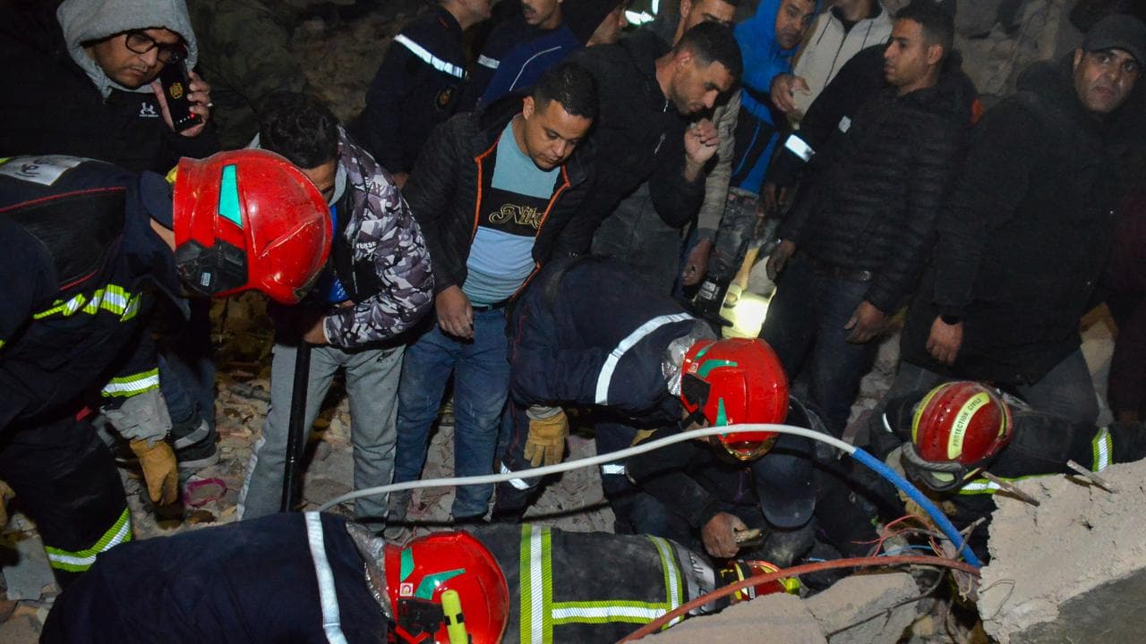 Rescue workers and reisdents search for survivors