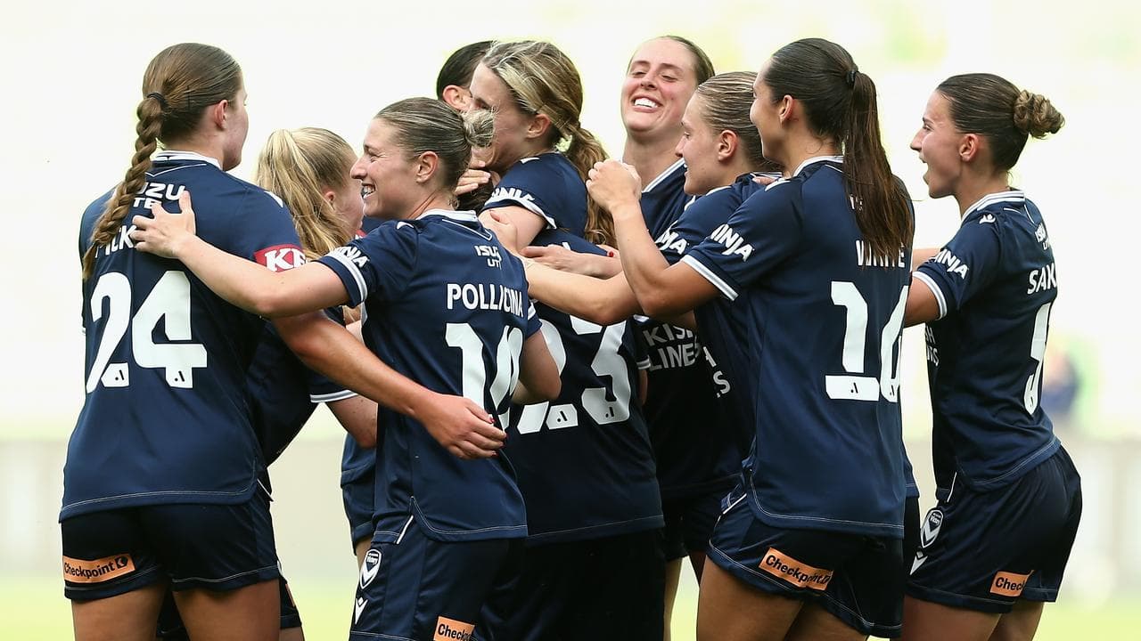 Melbourne Victory players celebrate a goal.