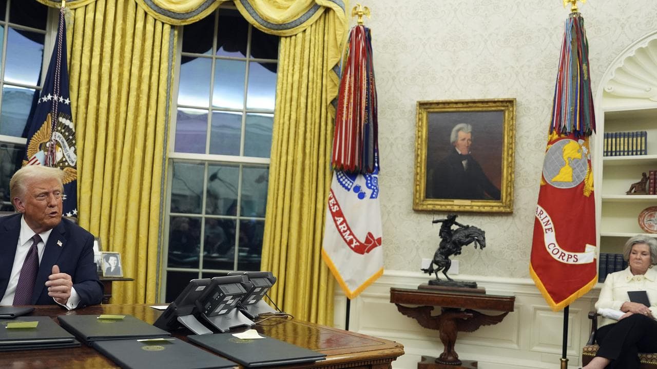 Chief of staff Susie Wiles watches as President Donald Trump talks