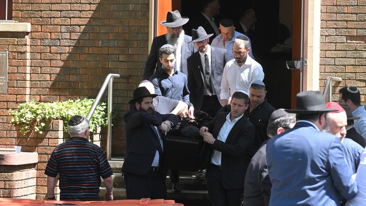 Mourners at a funeral service for Bondi victims.