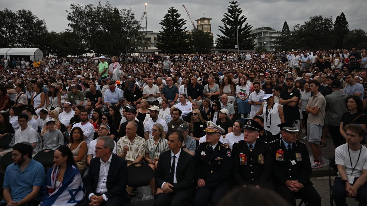A large crowd attends a National Day of Reflection vigil