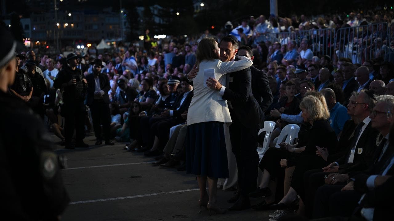 NSW Premier Chris Minns embraces Opposition Leader Kellie Sloane,