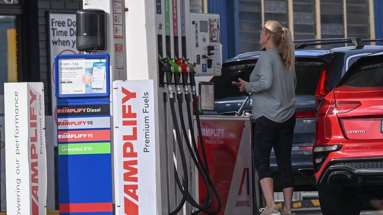 A motorist filling up her car