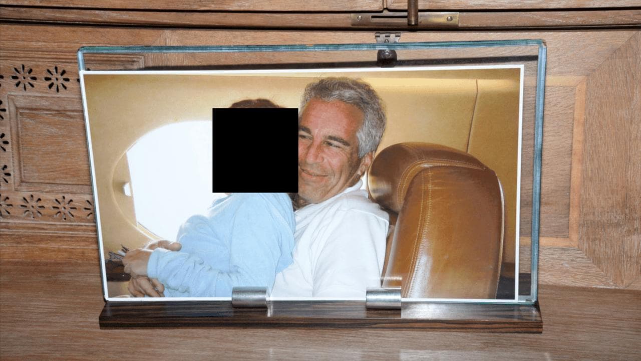 A framed photograph of Jeffrey Epstein with another person 