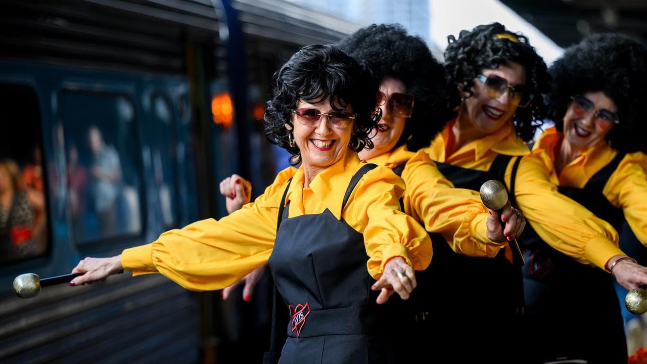 Fans in Elvis themed outfits at Central station