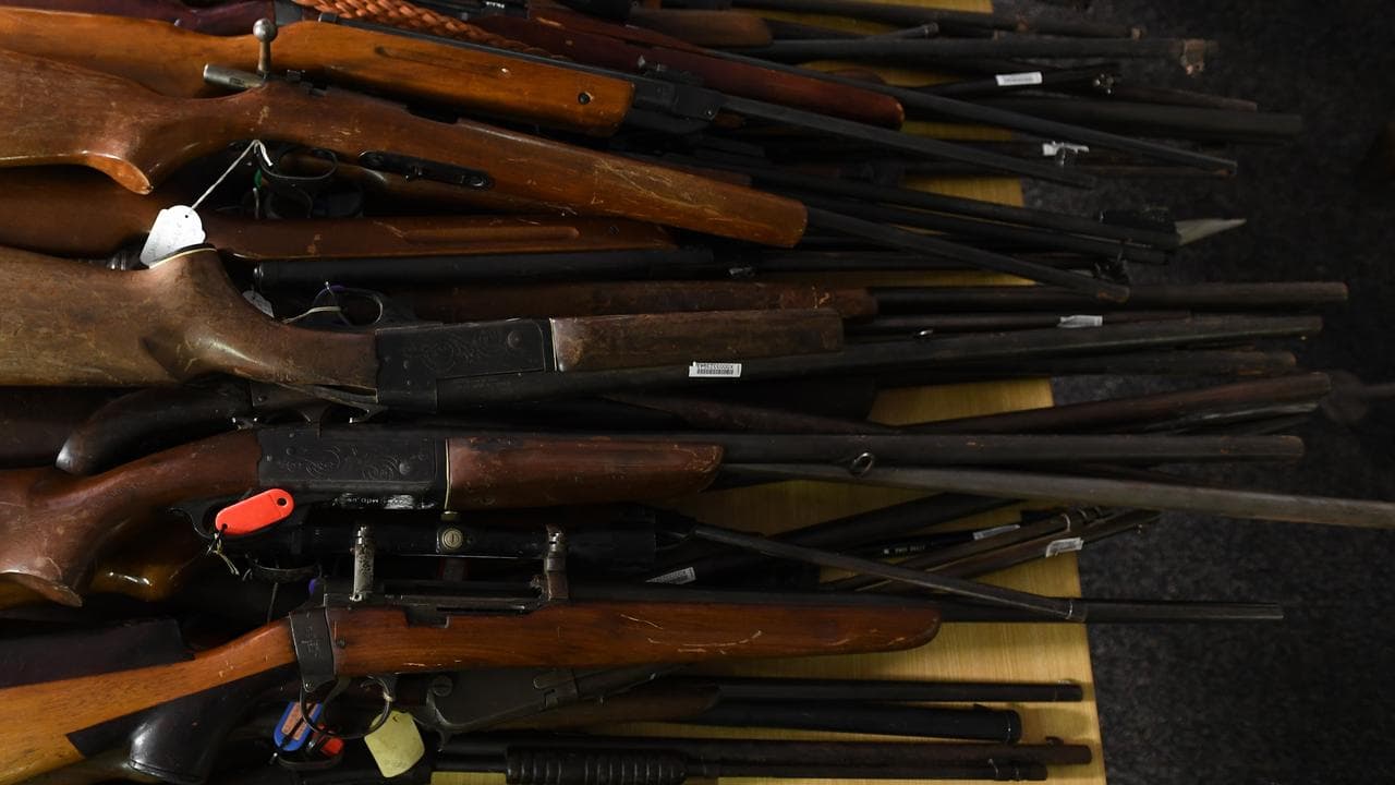 An assortment of hand guns and rifles handed (file image)
