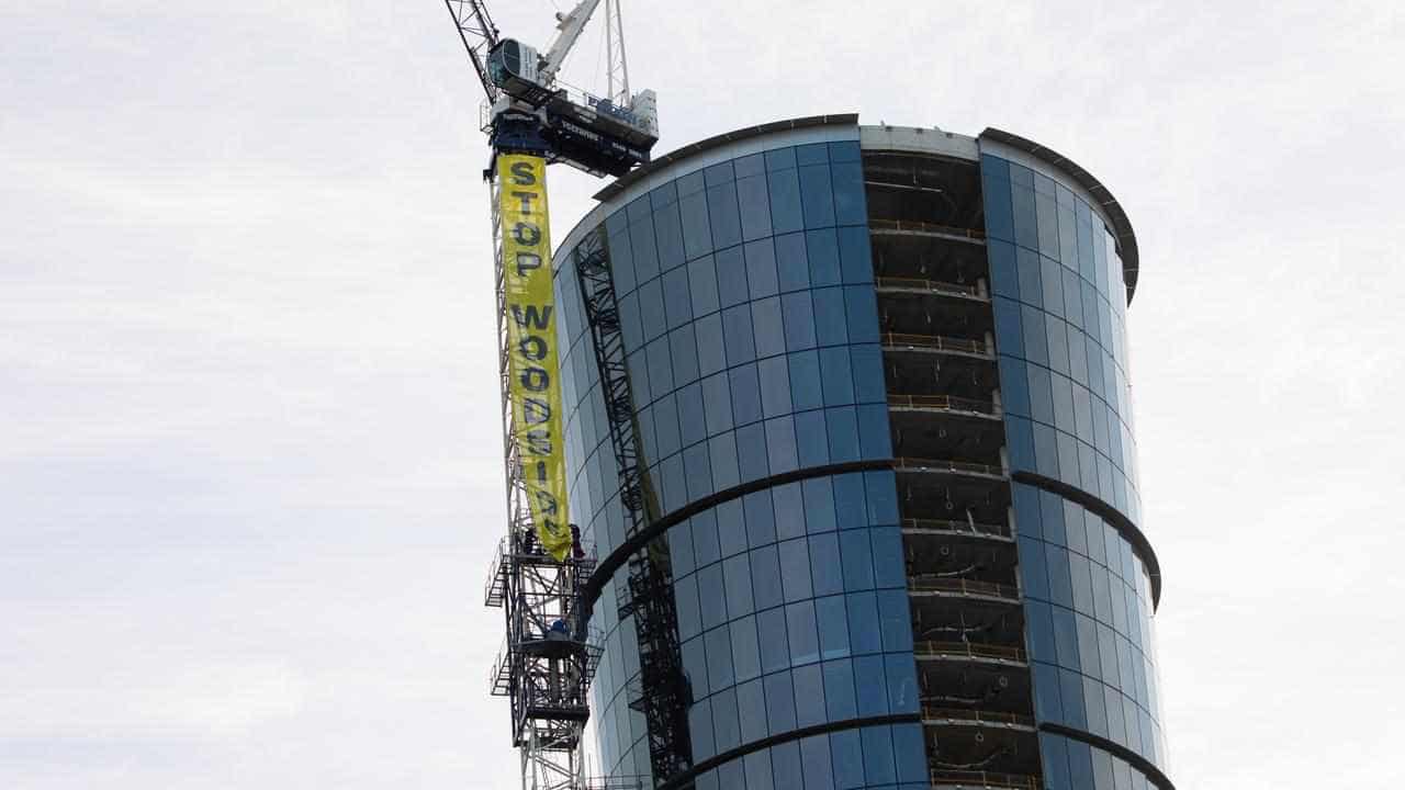 Climate activists scale 140-metre crane at Woodside HQ