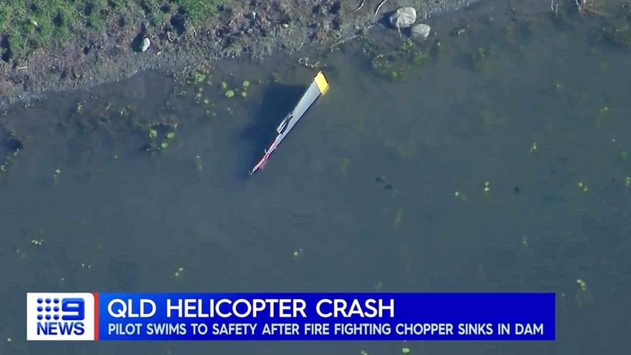 Firefighting pilot escapes as chopper fills with water
