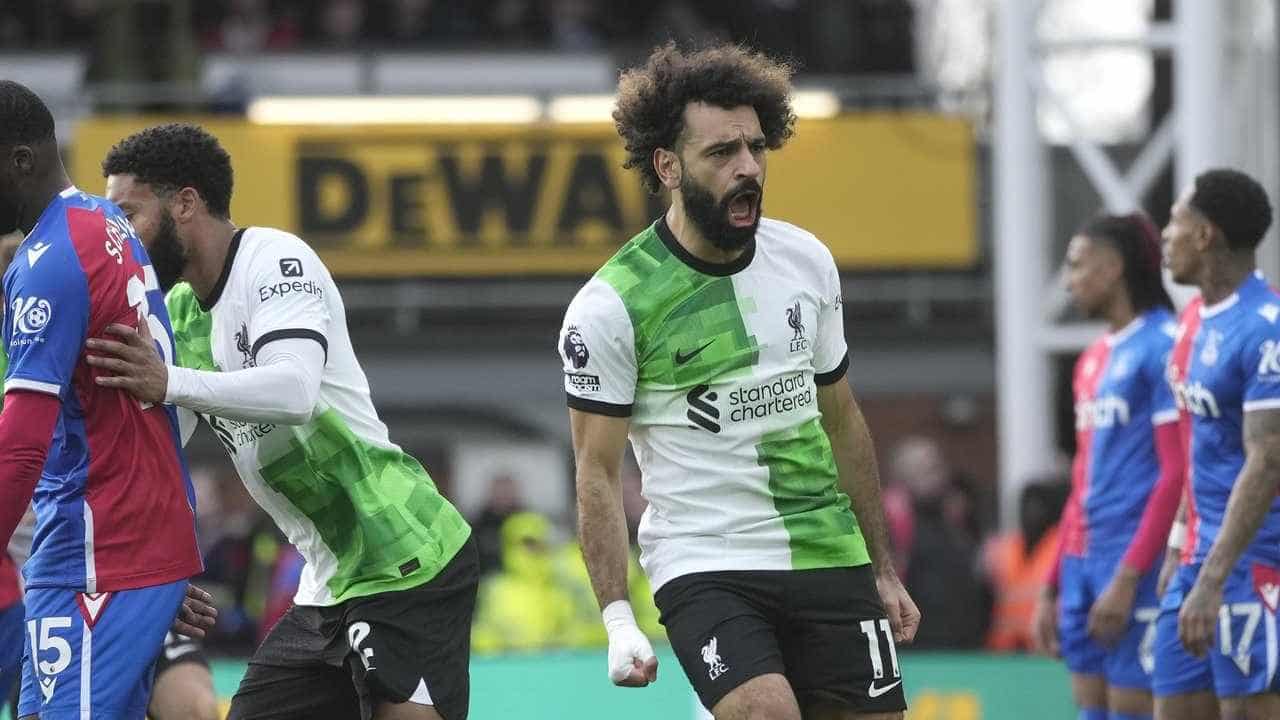 Salah's 200th goal sends 'lucky' Liverpool top of EPL