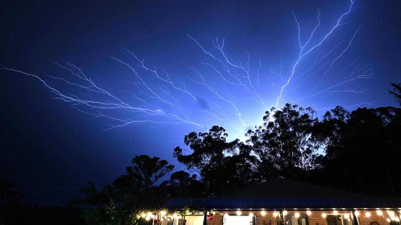 Two dead, four missing as storms lash southeast Qld