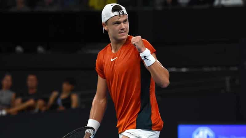 Top seed Rune overcomes Purcell in rainy Brisbane