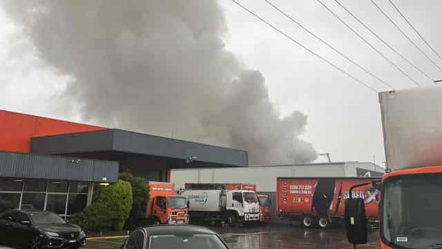 Recycling factory fire sends black smoke billowing