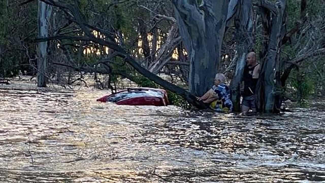 Floods swamp towns as kayaker found safe and well