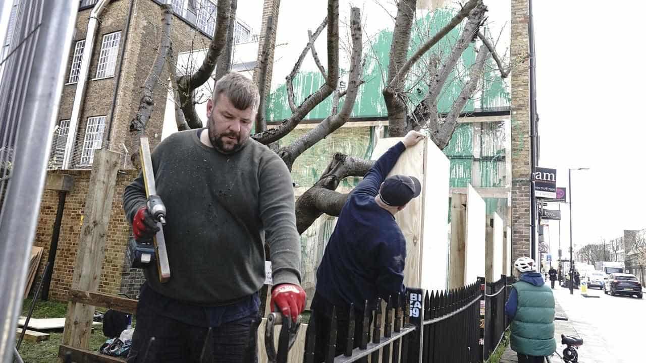 Banksy tree mural fenced off after apparent vandalism