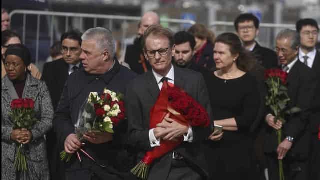 Ambassadors lay flowers at site of Russia hall massacre