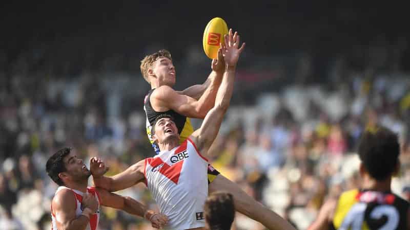 Tigers upset Swans to give Yze first win as coach