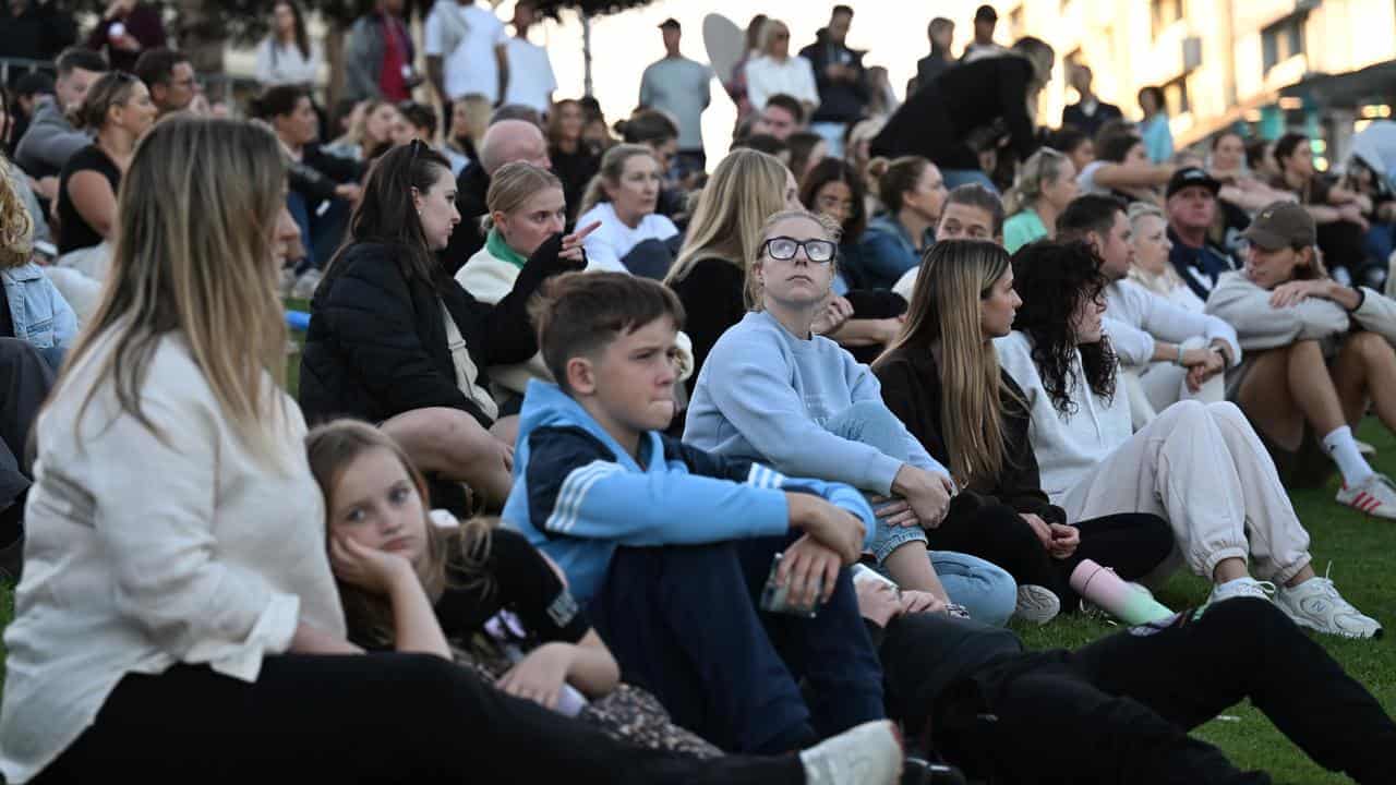 Mourners gather for beach vigil as baby leaves hospital