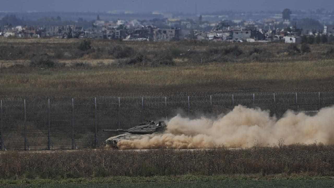 Israeli forces push into Gaza from north and south