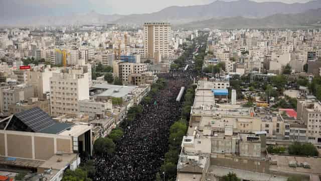 Mourners pack Iranian holy city for Raisi burial