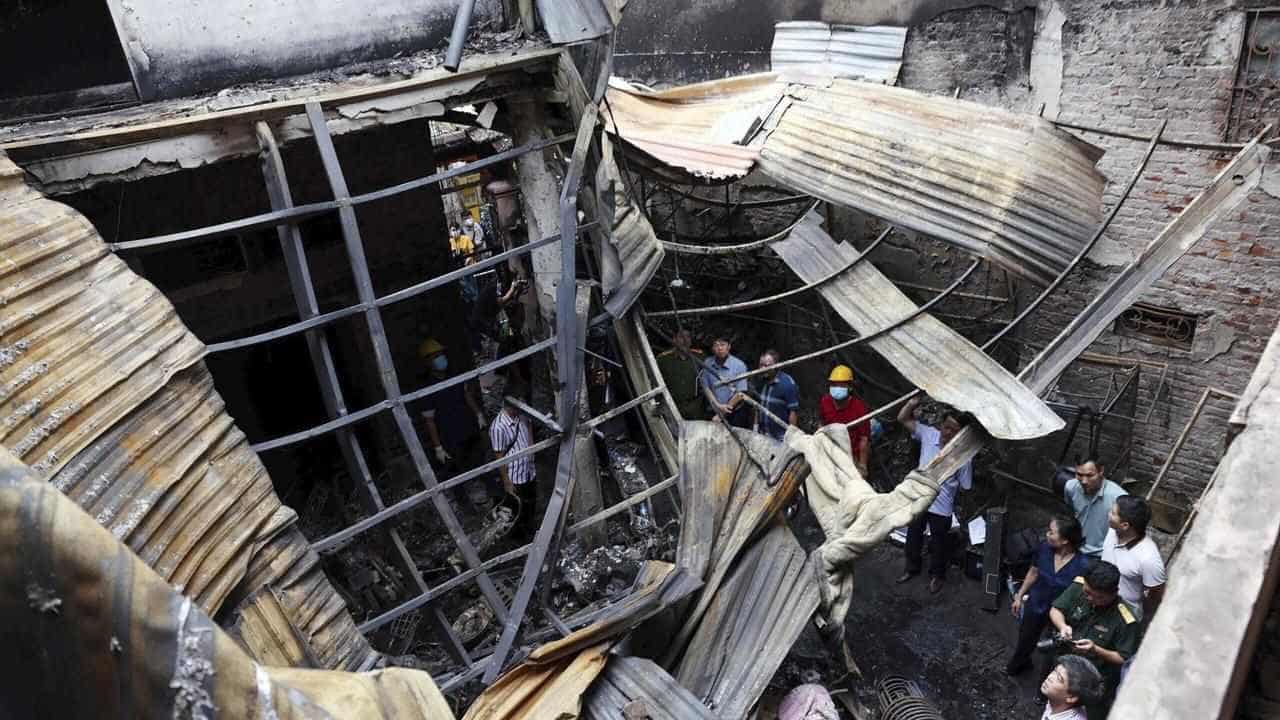 At least 14 dead in Vietnam residential building fire