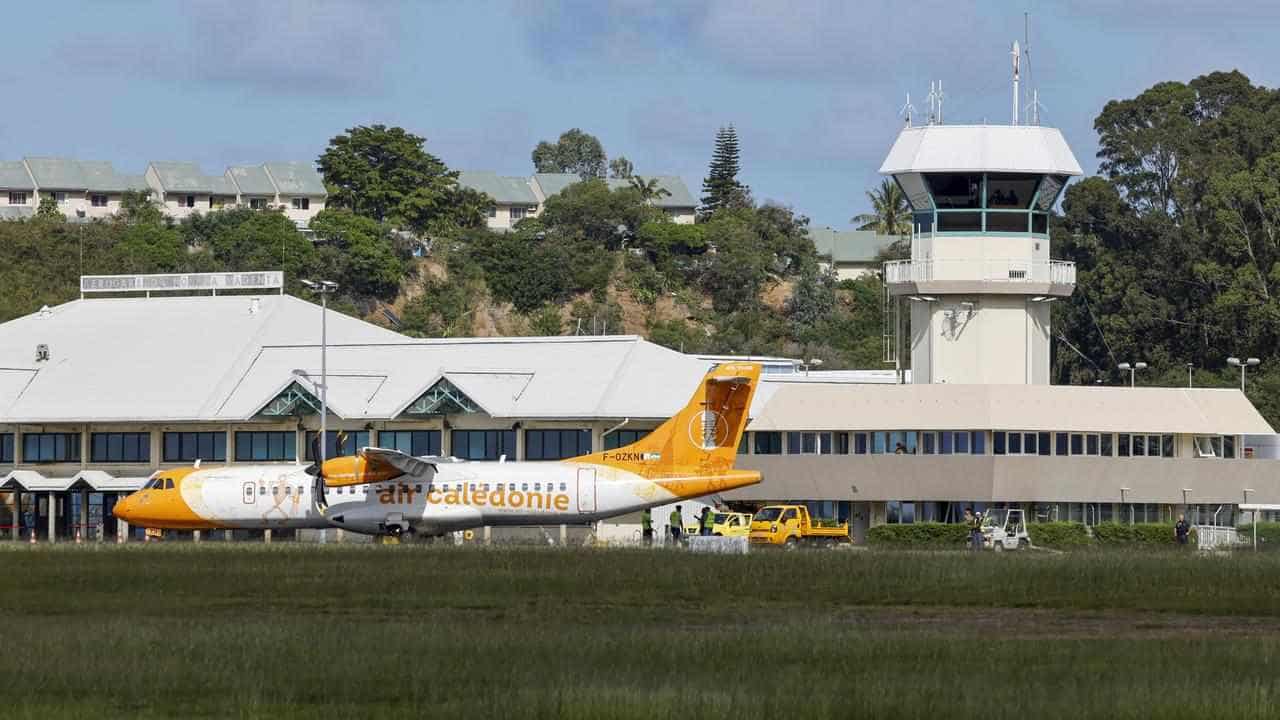 New Caledonia to reopen airport, shorten curfew