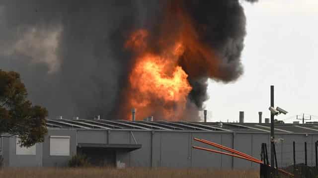 Toxic factory fireball contained but will rage for days