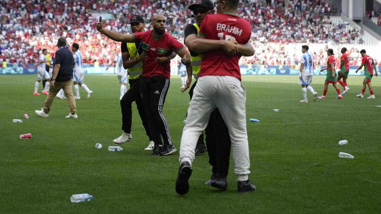 Morocco fans' pitch invasion halts match with Argentina