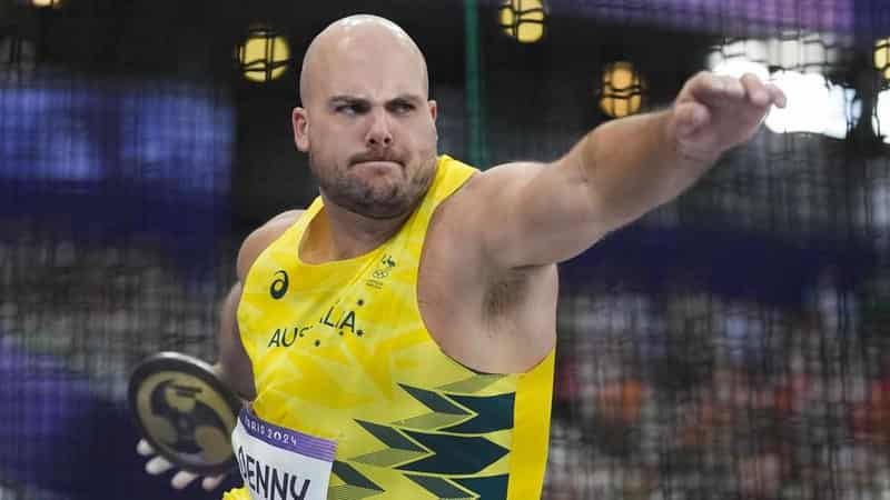 Denny's home circle visions spur historic discus medal