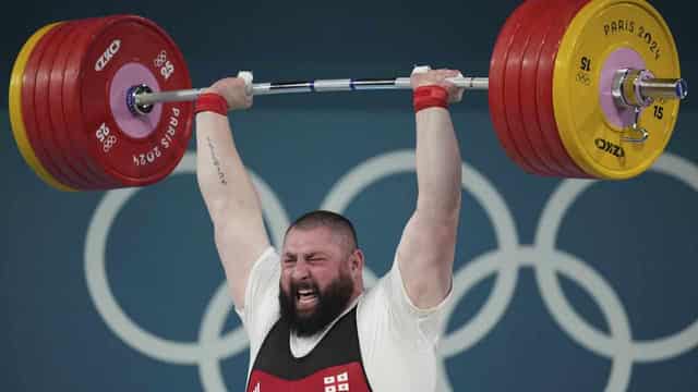 Strongman Talakhadze three-peats as weightlifting champ