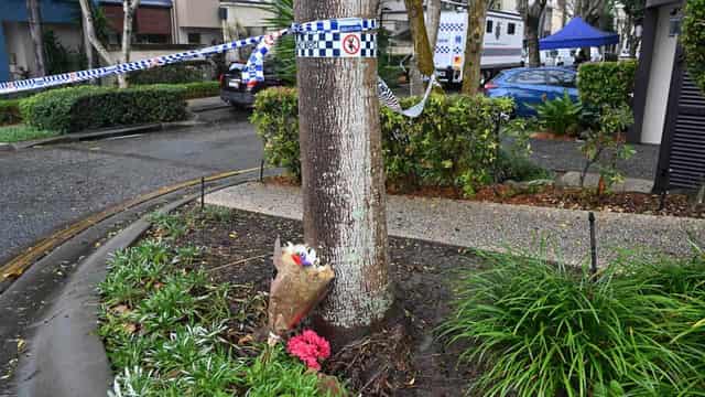 Vigil for slain girl as community embraces stricken dad