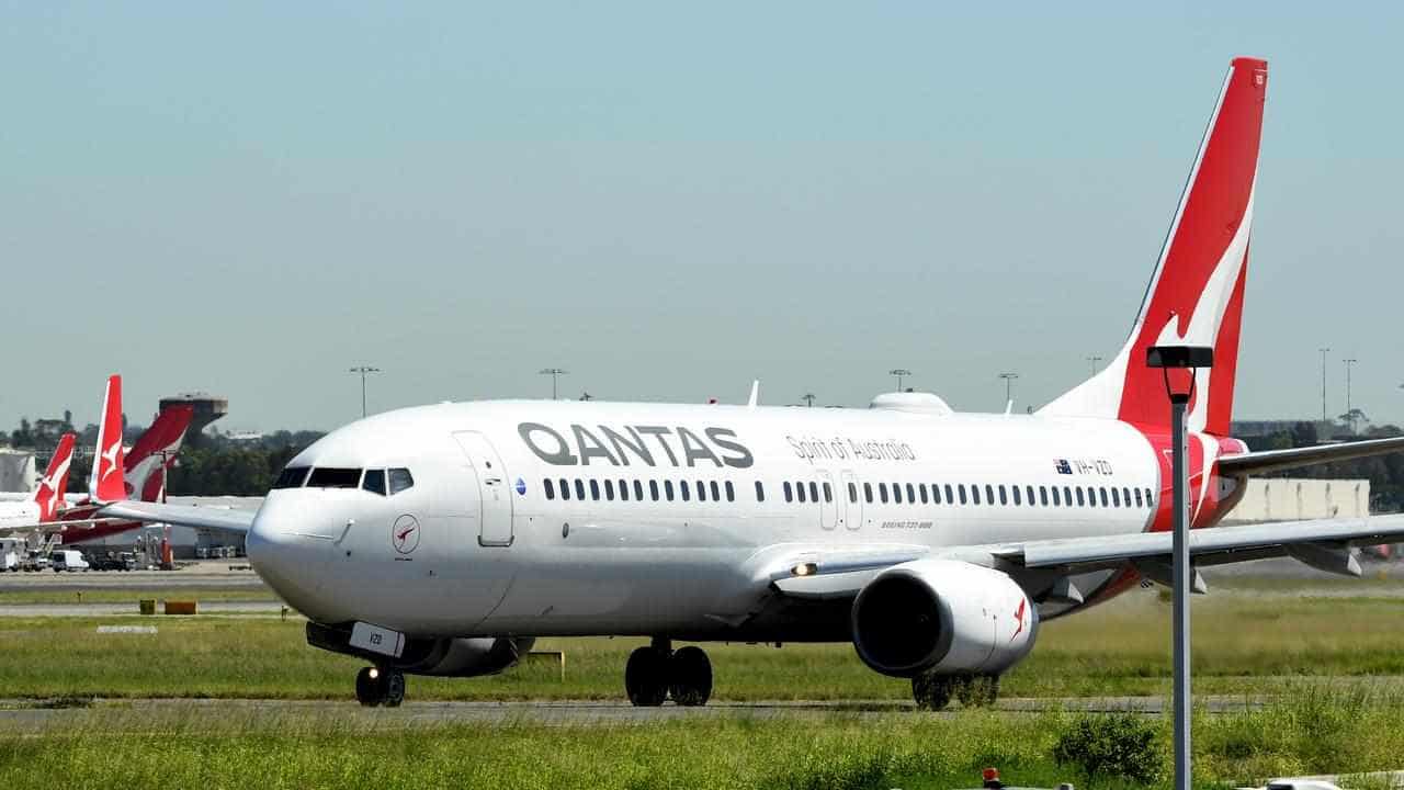 Qantas releases the loyalty parachute as profits fall