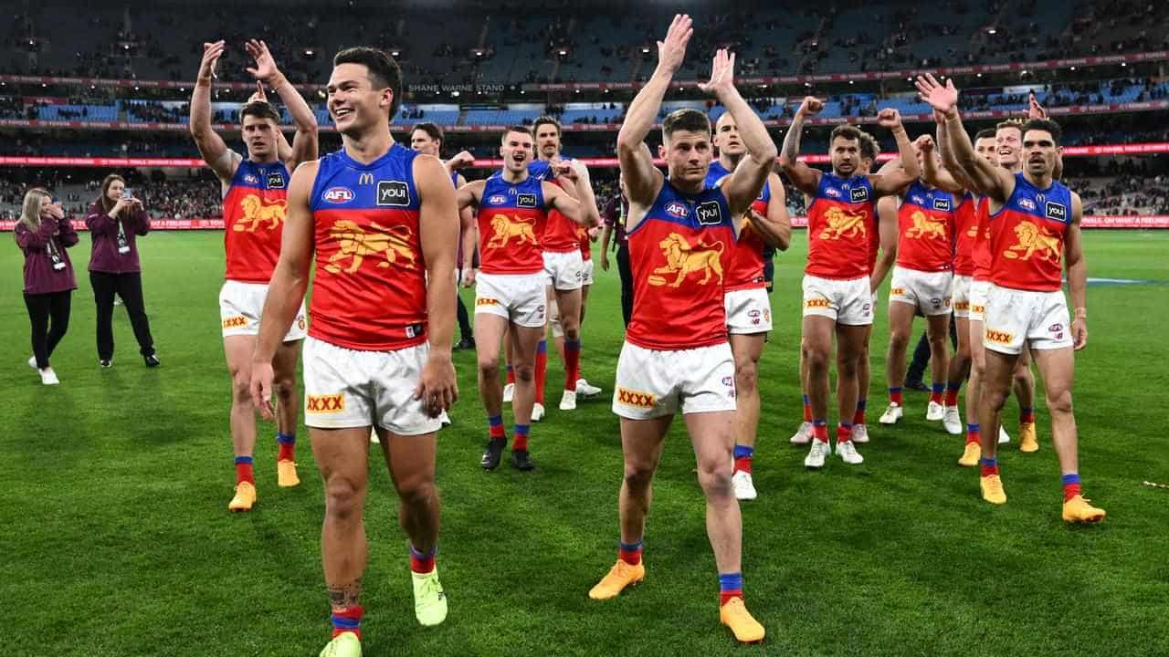 Lions roar into AFL grand final, but lose injured ruck