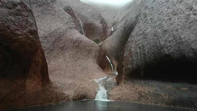 Record-breaking storms leave Uluru with waterfalls